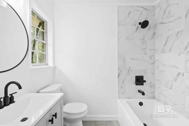 full bathroom with toilet, tiled shower / bath, crown molding, and vanity