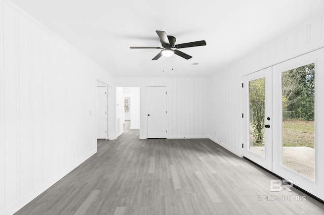 empty room with ceiling fan, light hardwood / wood-style flooring, and a wealth of natural light