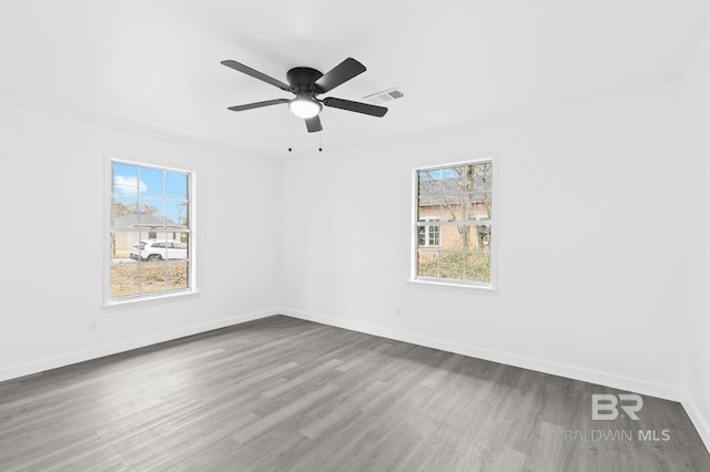 unfurnished room with ceiling fan and hardwood / wood-style floors