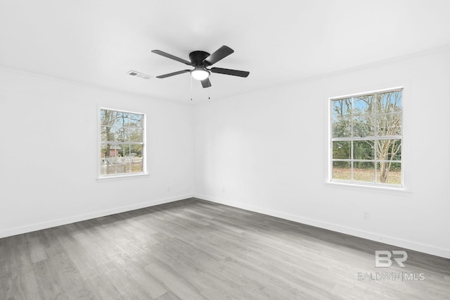 unfurnished room featuring ceiling fan and wood-type flooring