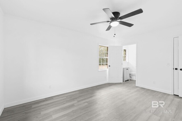 empty room with light wood-type flooring and ceiling fan