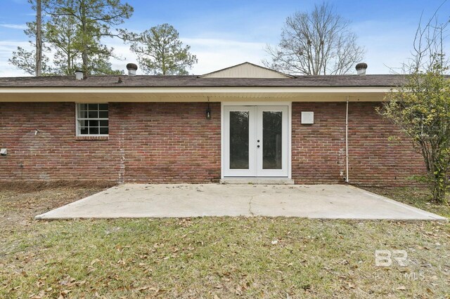 back of house featuring french doors, a yard, and a patio area