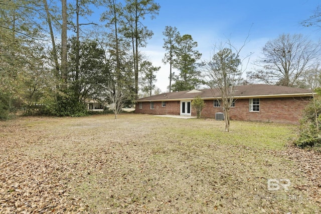 back of house with a yard