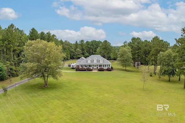 view of home's community with a yard and a rural view