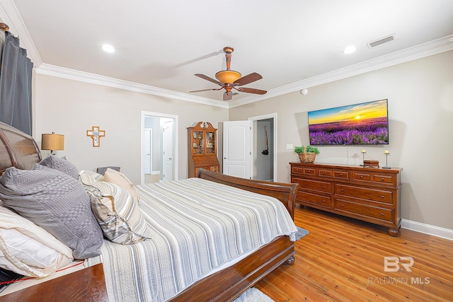 bedroom featuring crown molding, light hardwood / wood-style flooring, and ceiling fan