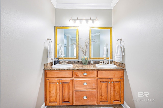 bathroom with ornamental molding and vanity