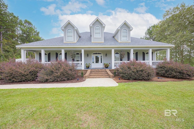 view of front of home with a front yard and covered porch