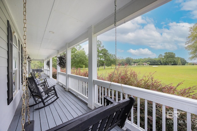 wooden terrace featuring a porch