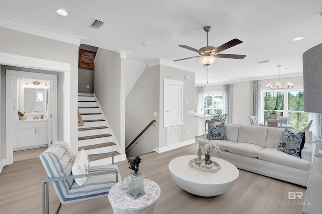 2831 Salt Dr, Orange Beach, AL 36561 - living room featuring light wood-style flooring, a ceiling fan, recessed lighting, baseboards, and a chandelier