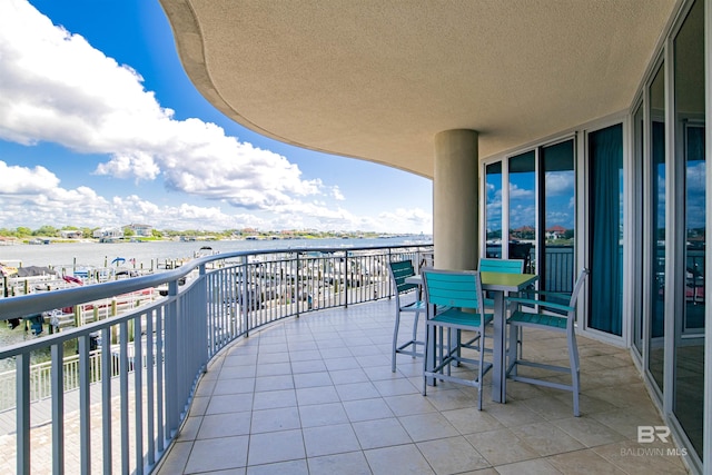 balcony featuring a water view