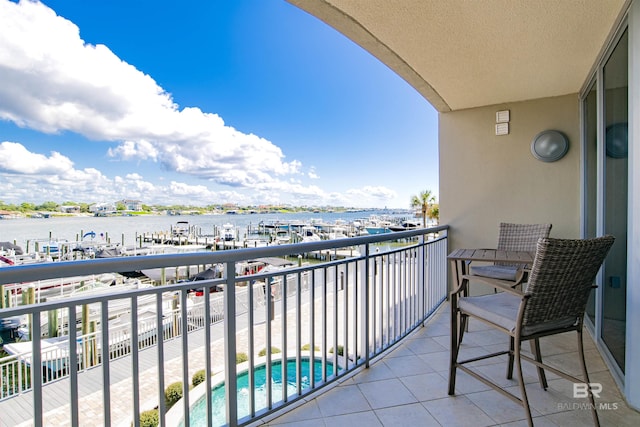 balcony featuring a water view