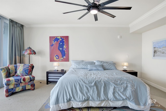 carpeted bedroom featuring ceiling fan and crown molding