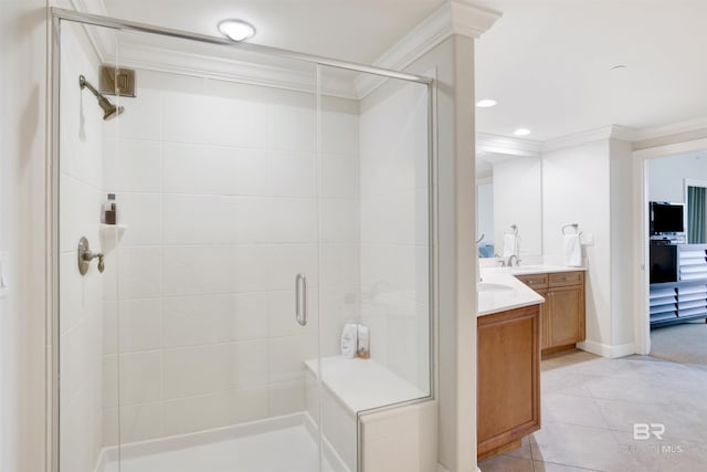 bathroom with walk in shower, vanity, tile patterned flooring, and ornamental molding