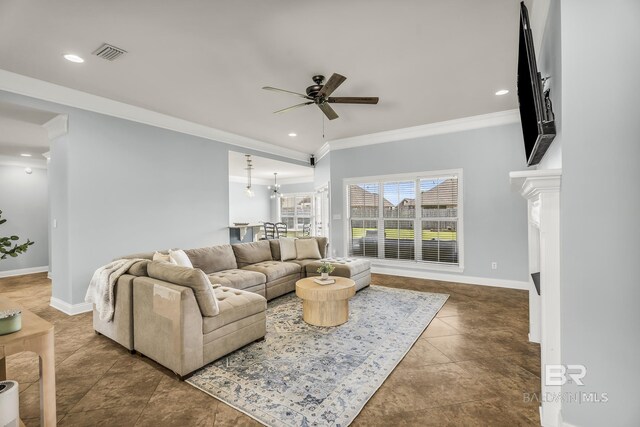 living area with recessed lighting, visible vents, ornamental molding, a ceiling fan, and baseboards