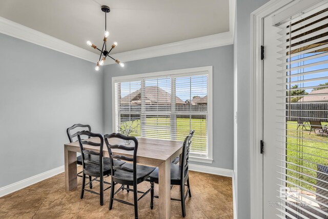 dining space featuring ornamental molding, tile patterned flooring, a notable chandelier, and baseboards