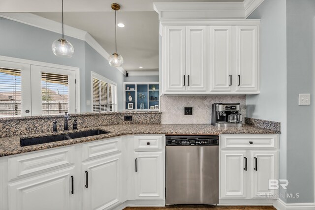 kitchen featuring pendant lighting, white cabinets, a sink, dark stone counters, and dishwasher