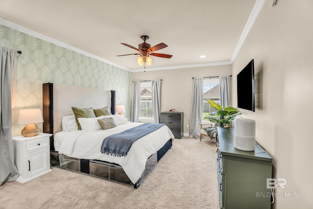 carpeted bedroom featuring ceiling fan and crown molding