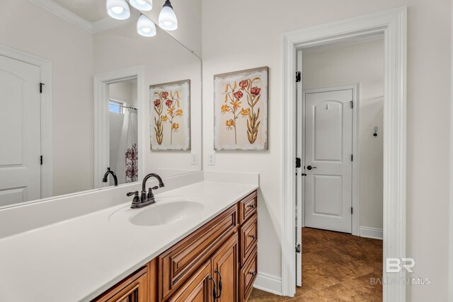 full bath with baseboards and vanity