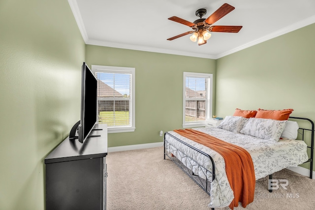 carpeted bedroom with multiple windows, ornamental molding, and ceiling fan