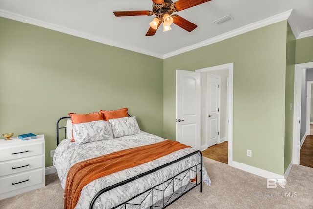 bedroom with ceiling fan, carpet, and ornamental molding