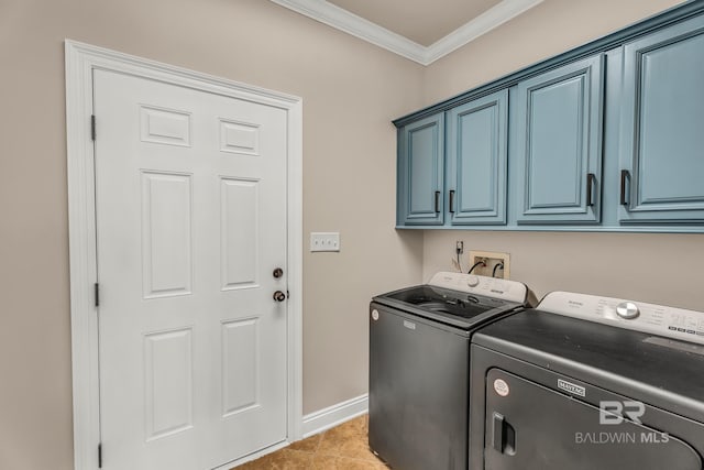 washroom featuring light tile patterned floors, cabinets, separate washer and dryer, and ornamental molding