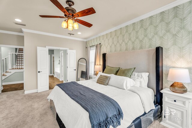 bedroom with light colored carpet, visible vents, baseboards, wallpapered walls, and crown molding