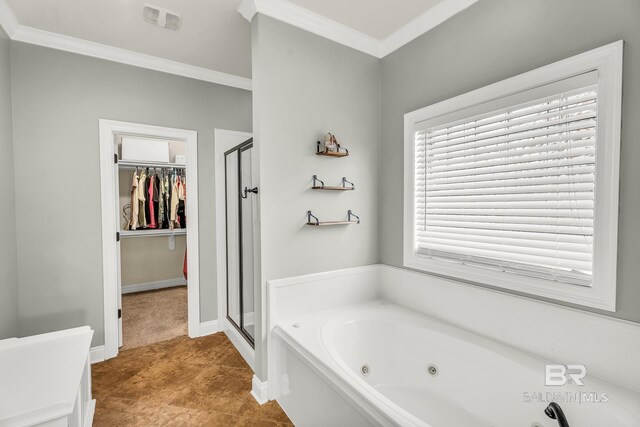 bathroom with a shower stall, a spacious closet, ornamental molding, and a tub with jets