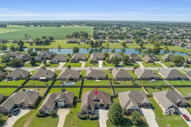 birds eye view of property featuring a water view and a residential view