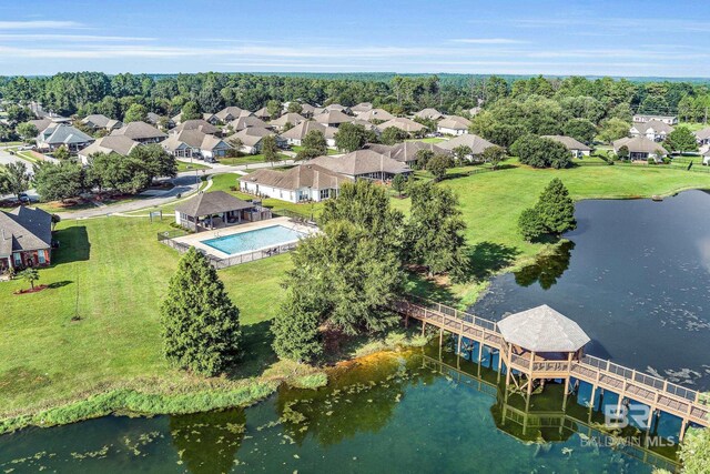 bird's eye view with a residential view and a water view