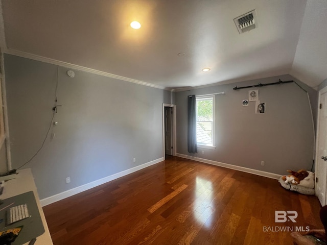 interior space featuring dark hardwood / wood-style flooring and ornamental molding