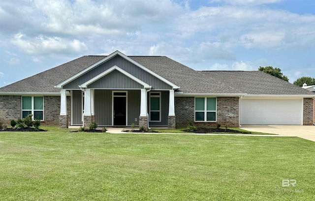 craftsman inspired home with a garage and a front yard