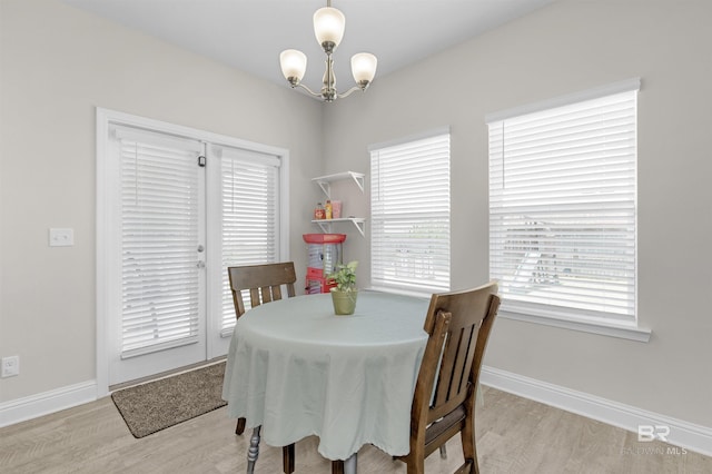 2345 Laurel St, Semmes, AL 36575 - dining area with wood finished floors and a chandelier