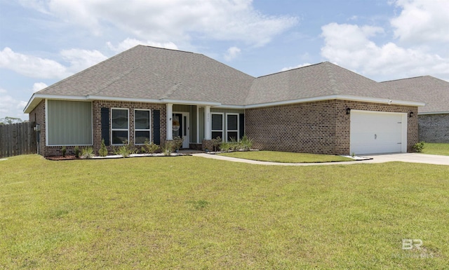 2345 Laurel St, Semmes, AL 36575 - view of front of home with brick siding, an attached garage, driveway, and a shingled roof