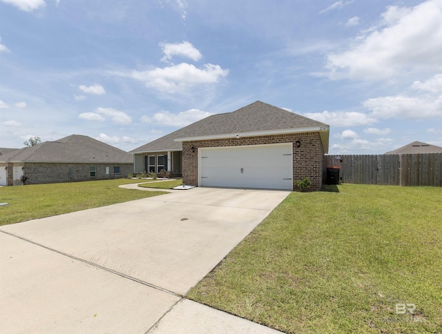 2345 Laurel St, Semmes, AL 36575 - ranch-style house featuring brick siding, a garage, driveway, and a shingled roof