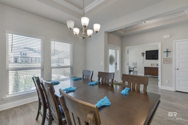 2345 Laurel St, Semmes, AL 36575 - dining room featuring crown molding, a chandelier, and wood finished floors