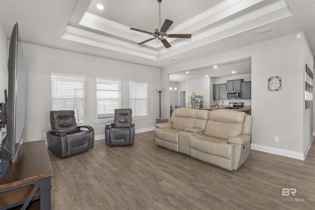2345 Laurel St, Semmes, AL 36575 - living area with a raised ceiling, wood finished floors, crown molding, a ceiling fan, and recessed lighting