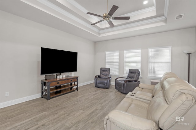 2345 Laurel St, Semmes, AL 36575 - living room featuring a raised ceiling, crown molding, a ceiling fan, light wood-type flooring, and recessed lighting