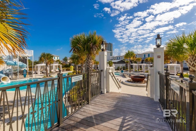 2471 Saltgrass Way, Orange Beach, AL 36561 - deck with a patio area and a community pool