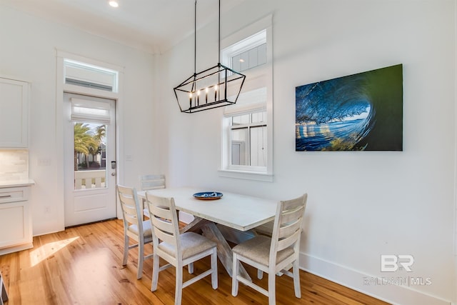 2471 Saltgrass Way, Orange Beach, AL 36561 - dining space featuring light hardwood / wood-style floors and a notable chandelier