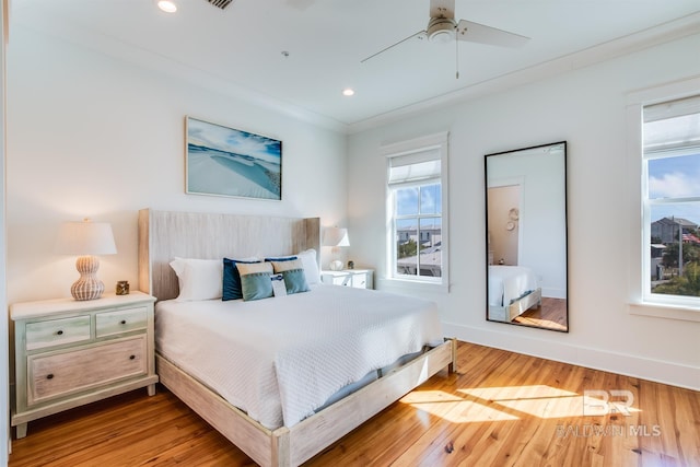 2471 Saltgrass Way, Orange Beach, AL 36561 - bedroom featuring ceiling fan, crown molding, and hardwood / wood-style flooring