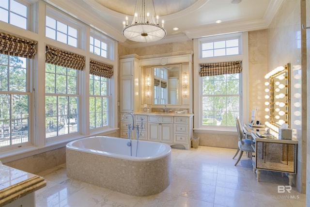 bathroom featuring tiled bath, a high ceiling, vanity, a tray ceiling, and crown molding