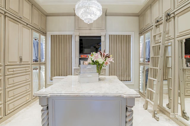 laundry area with a chandelier and crown molding