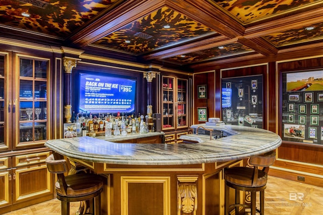 bar with coffered ceiling, wood walls, ornamental molding, and beamed ceiling