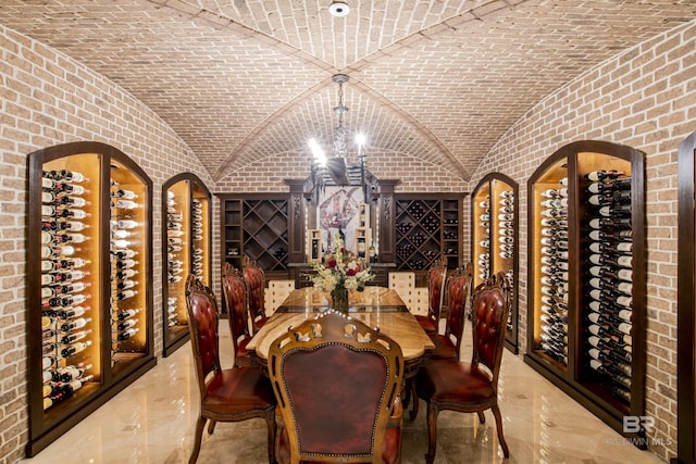 wine area with brick ceiling and vaulted ceiling