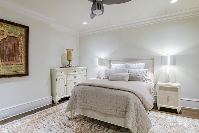 bedroom featuring hardwood / wood-style floors, ceiling fan, and crown molding