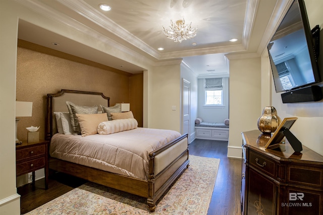 bedroom featuring ornamental molding, dark wood-type flooring, and a notable chandelier