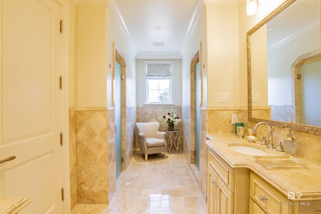 bathroom with vanity, tile walls, and ornamental molding