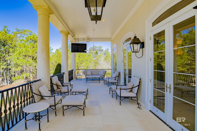 balcony with french doors and outdoor lounge area