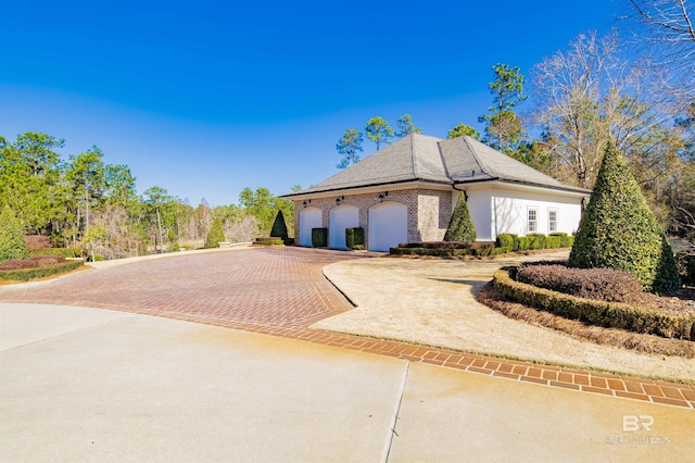 view of side of property with a garage