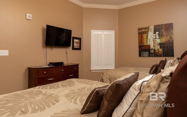 bedroom with ornamental molding